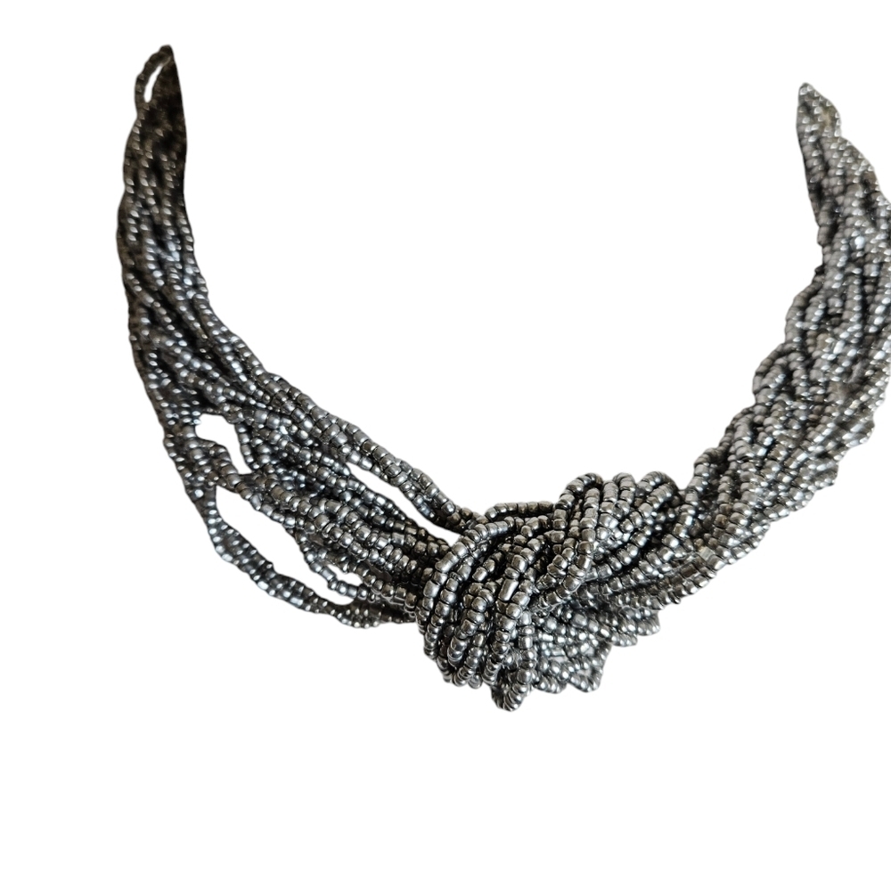 Silver beaded multi stranded necklace.